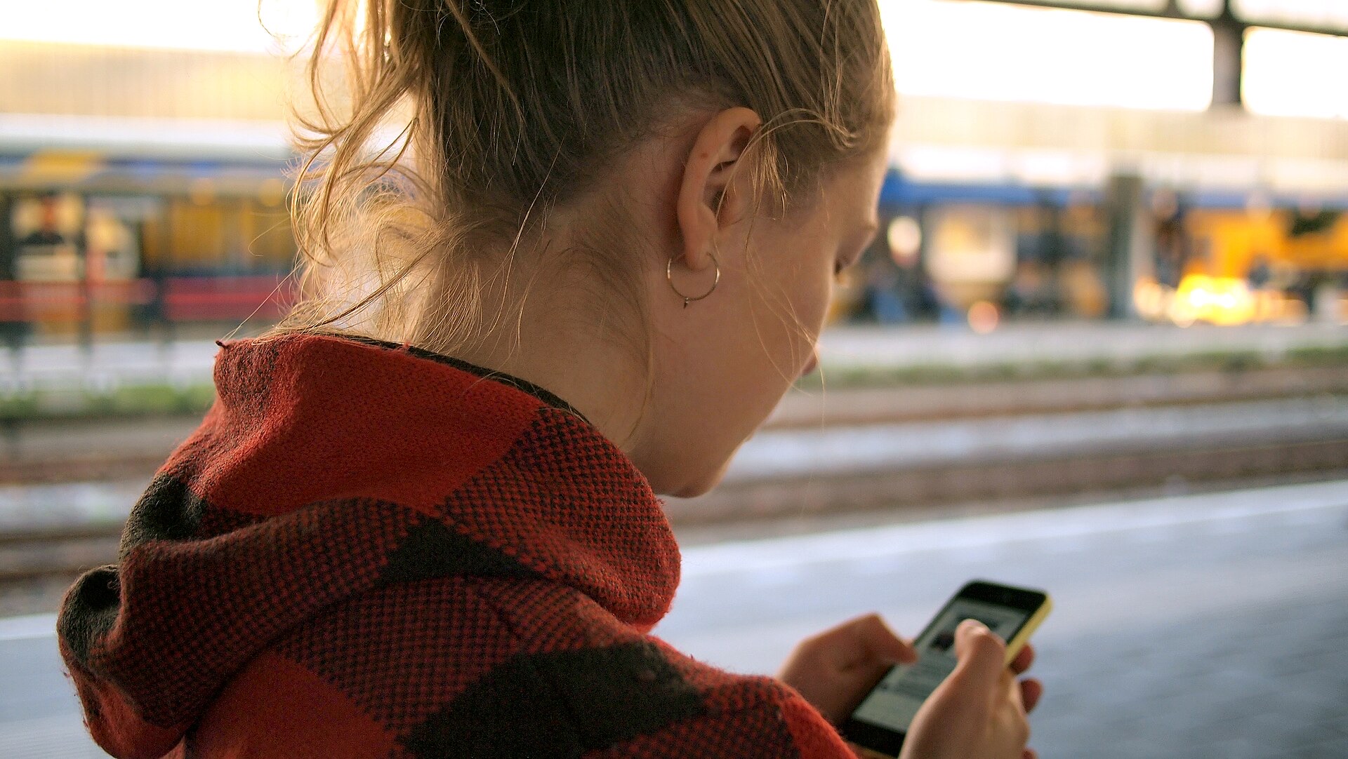 A commuter checking a MOVEA route map on their phone
